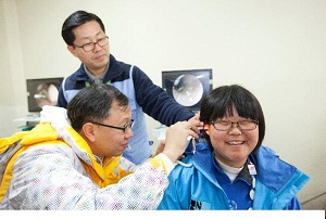A South Korean athlete participating in hearing screening