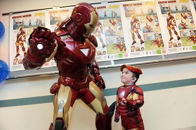 Iron Man greets five year-old Anthony Smith who inspired the Phonak Iron Man poster