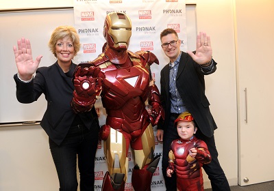 Kimberly Rawn from Phonak and Bill Rosemann from Marvel Comic Solutions join Iron Man and Anthony Smith at the special Iron Man Poster Event