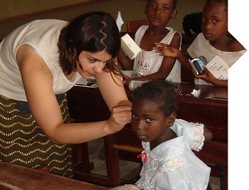 doctor looking at child patient's ear