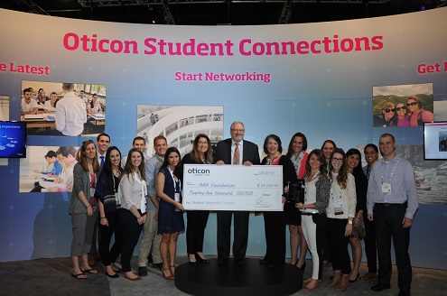 Oticon President Peer Lauritsen presents a $25,000 donation to the American Academy of Audiology Foundation’s Empowering People scholarship fund