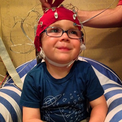 In the Northwestern study, scalp electrodes pick up how children's brains react to sounds such as speech in a noisy background