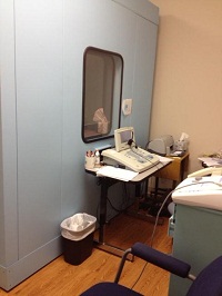 Basic audiology suite with seating and equipment