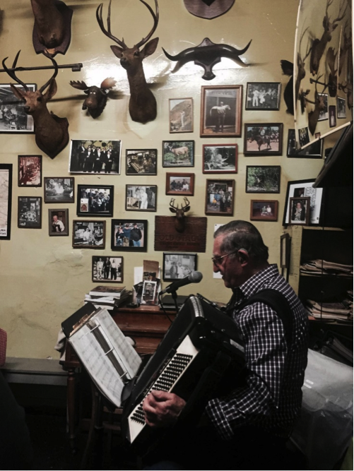 John playing the accordion