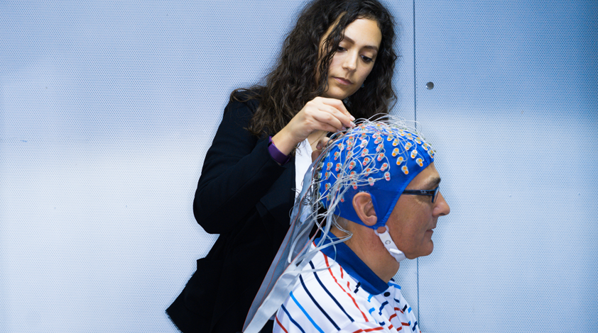 Nathalie Giroud prepares one of the test subjects for the hearing test