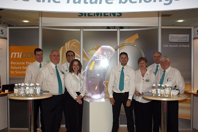The Siemens team with the micon illuminated exhibit