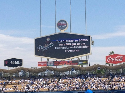 The Oakland scoreboard and the Dodger’s jumbotron display messages supporting Jacob’s ride