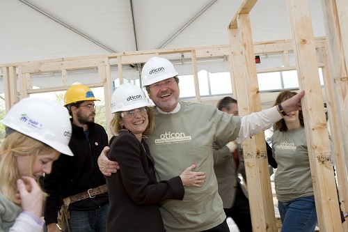 Oticon President Peer Lauritsen is joined by volunteers for a wall-raising challenge for a Habitat for Humanity home