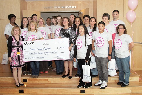  Joy Simha accepted the donation from Oticon at a special Breast Cancer & Hearing Health Awareness “Pink Day” at Oticon Headquarters