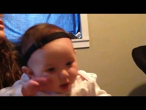 screenshot from video of a four-month-old baby at her fitting