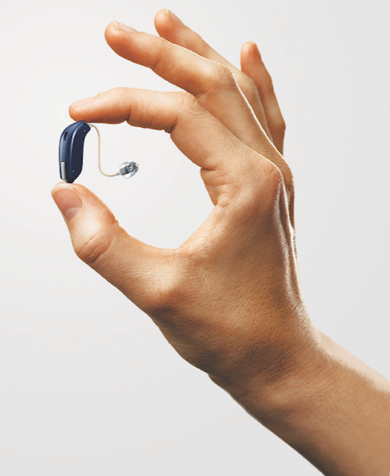 Hearing aid in a person's hand