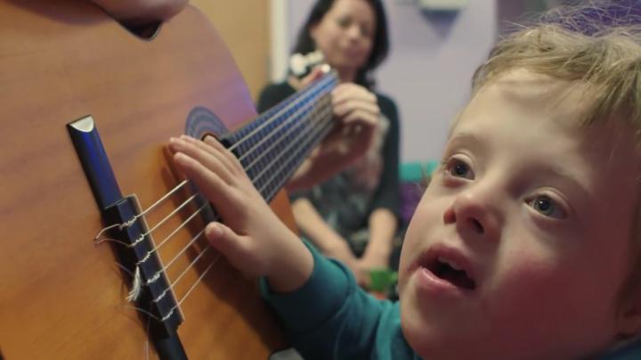 Special needs child with a guitar