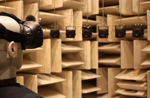 mannequin wears a VR headset in an anechoic chamber to measure the effects of simulated sound cues from different positions