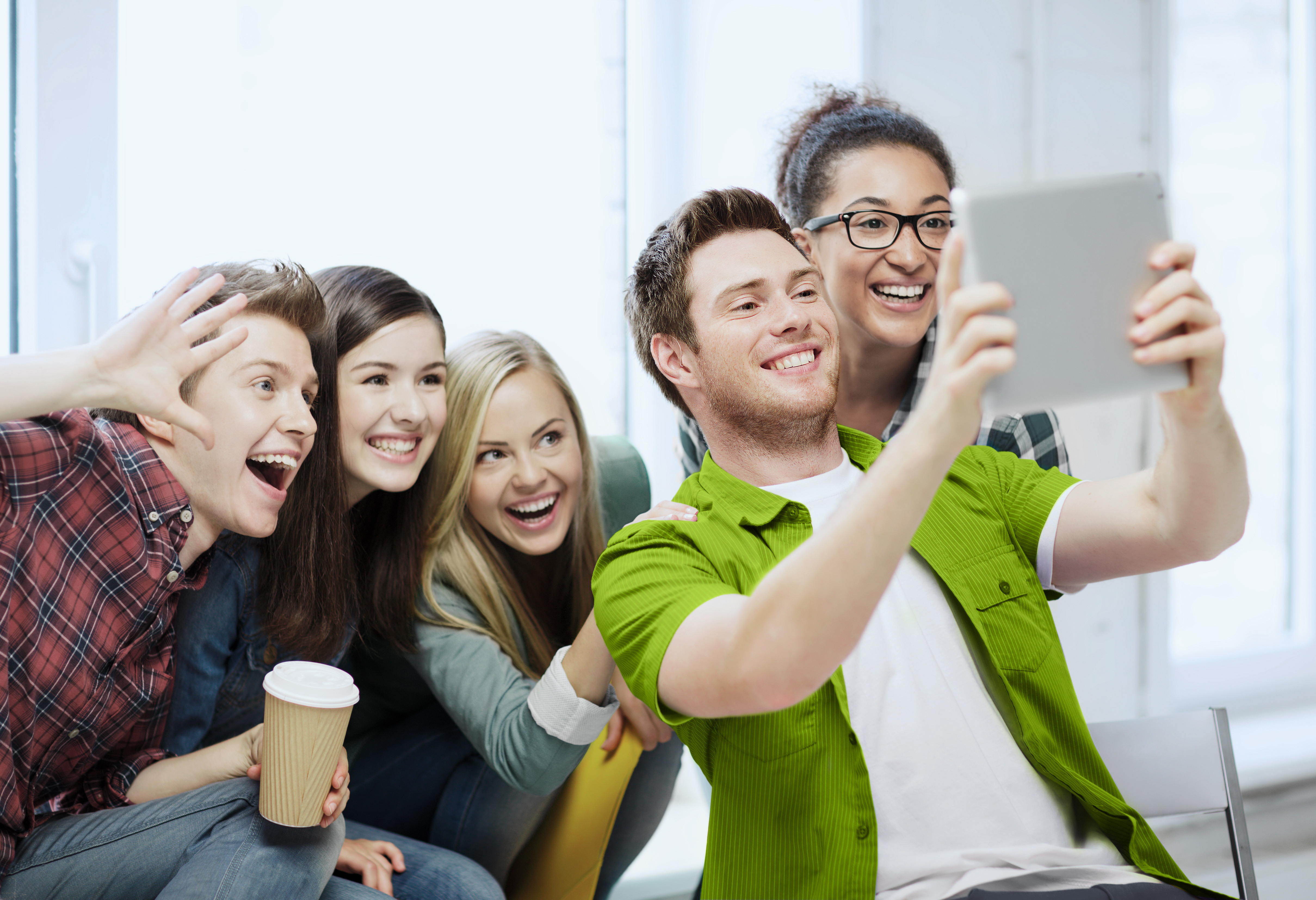 Young people talking through a tablet