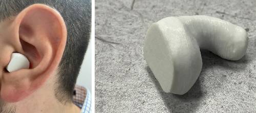 3D printed Filafex 70A ear plug in left ear and ear plug on desk.