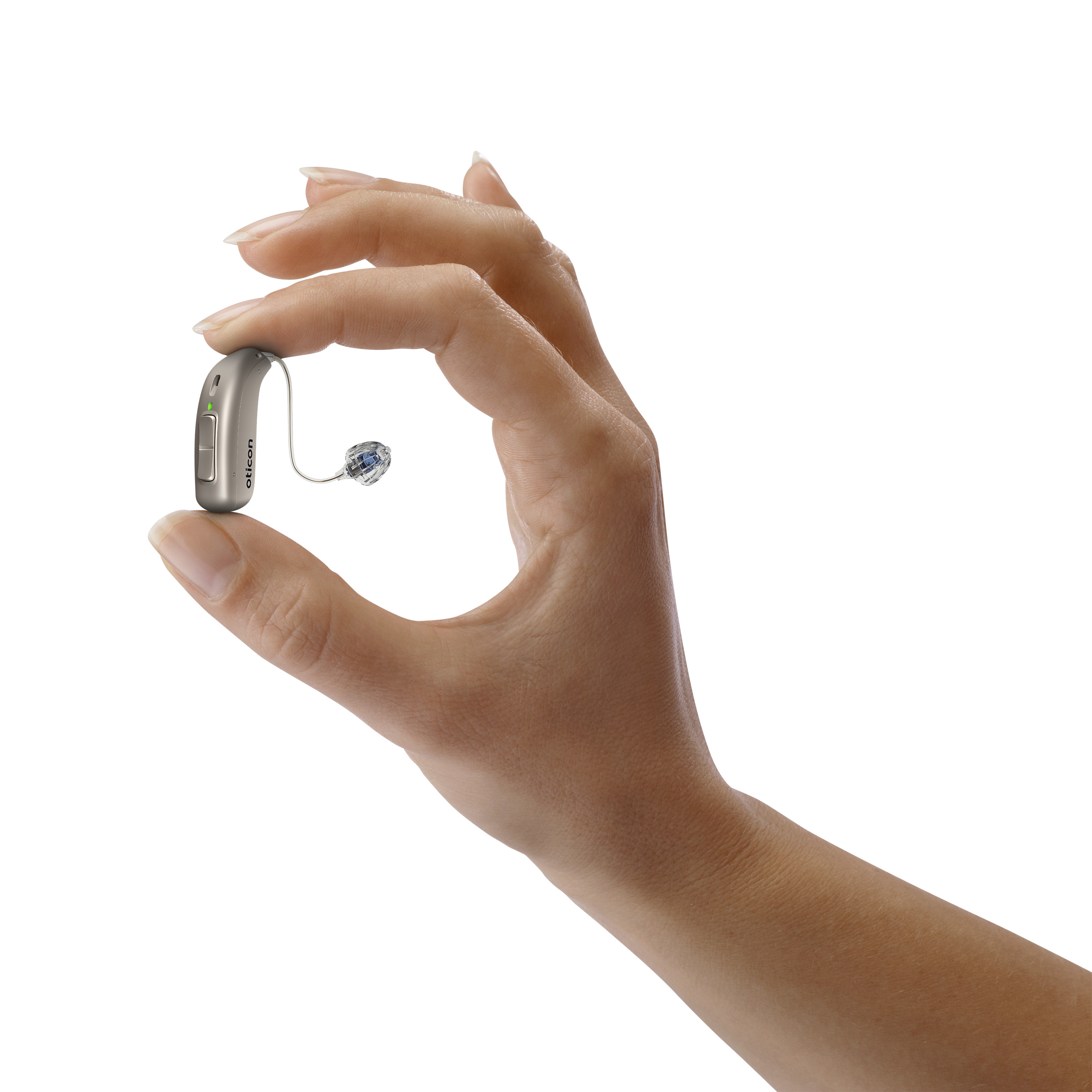A hand holding a hearing aid