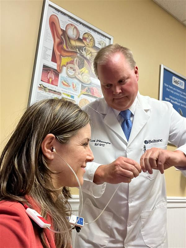 IHS Executive Director Alissa Parady with Keith Harrington, BC-HIS, during her annual hearing health check up.