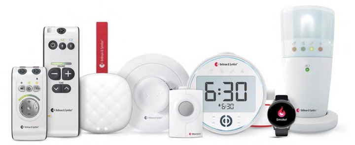 A collection of Bellman & Symfon alerting and notification devices, including remote controls, a baby monitor, a bedside alarm clock