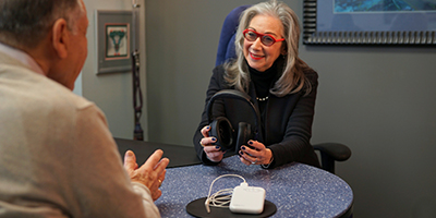 Dr. Gail Brenner, AuD, demonstrates the Lenire headphones as part of an in clinic consultation at The Tinnitus Treatment Center of Philadelphia